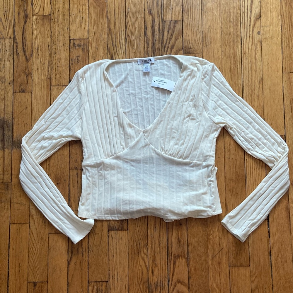 Ribbed beige long sleeve top with open tie back